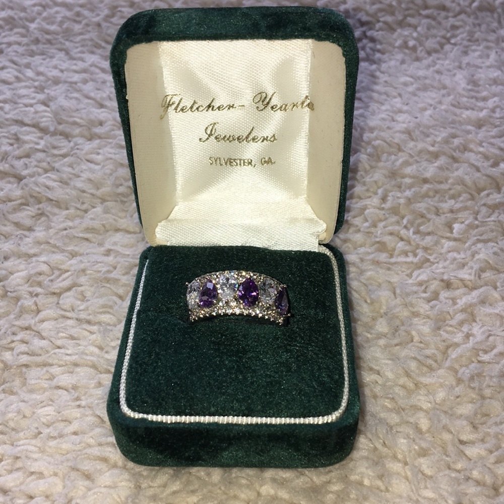 Silver ring with purple and blush stones.